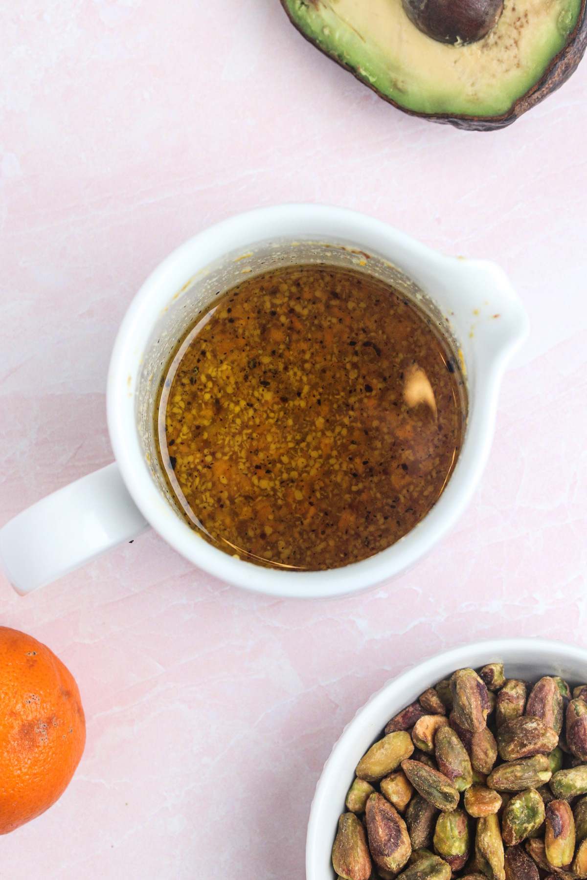 Prepared white wine vinaigrette in a small gravy pitcher.