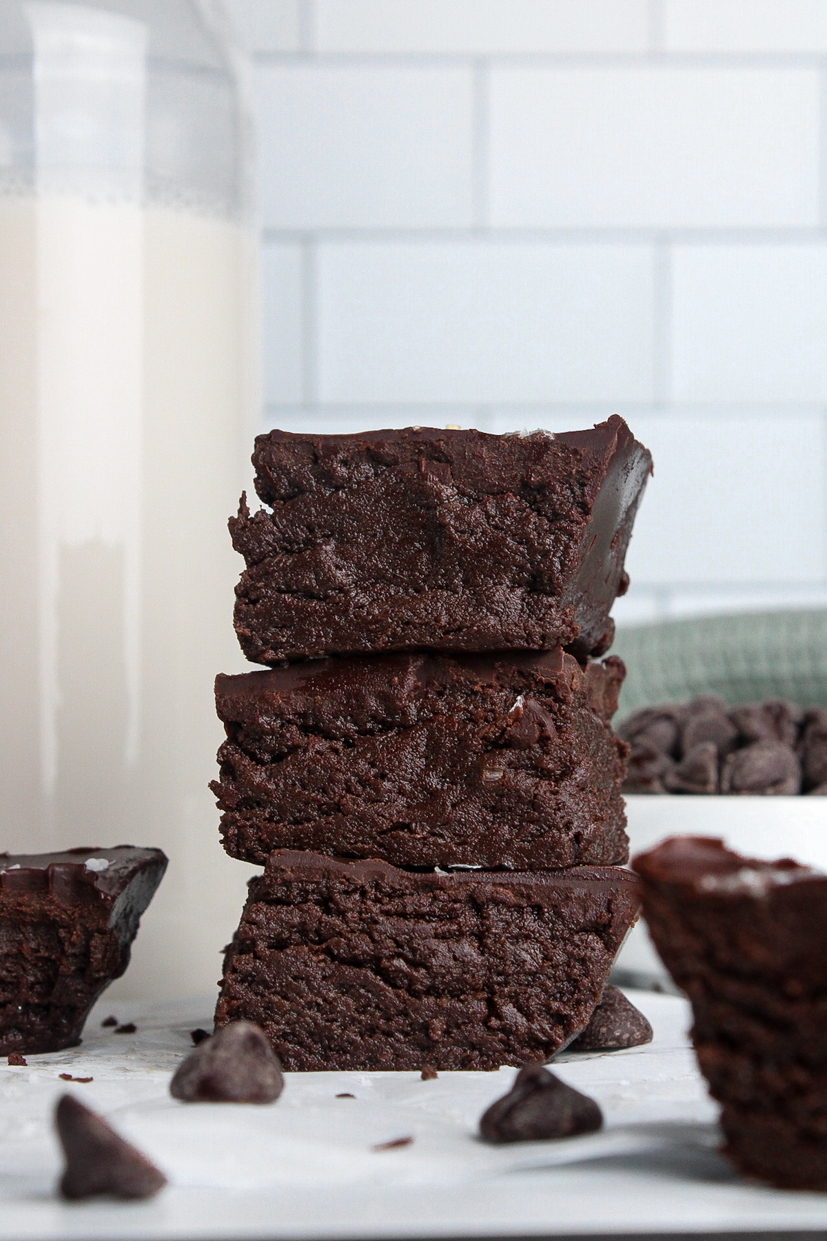 Thick, fudgy no-bake chocolate protein brownies showing their dense, chewy texture.