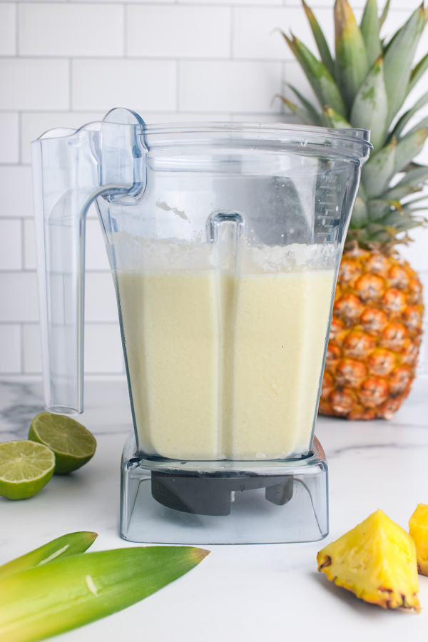 Smooth, creamy piña colada mocktail blended until thick and pale yellow.
