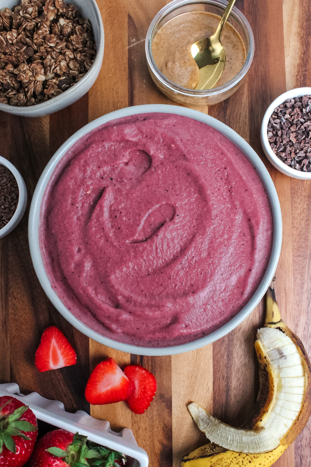 Thick strawberry banana espresso smoothie spread into a bowl.