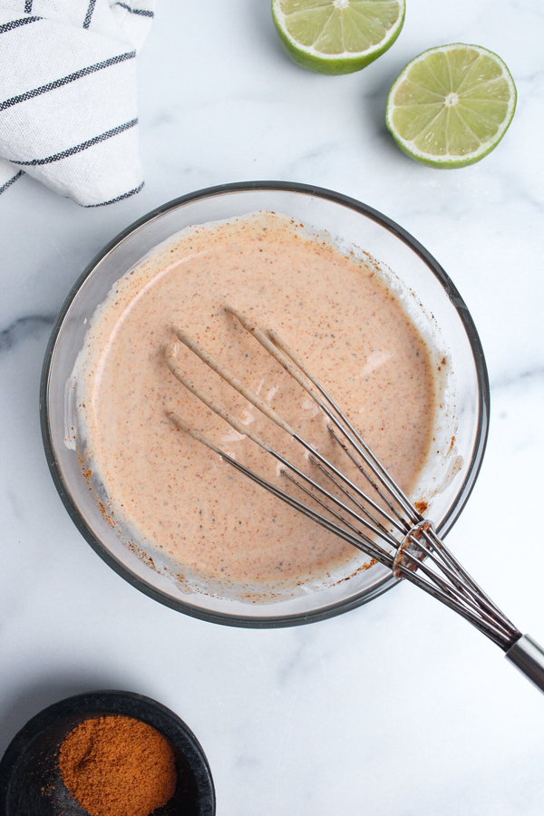 Creamy dairy-free taco-seasoned dressing whisked until smooth.