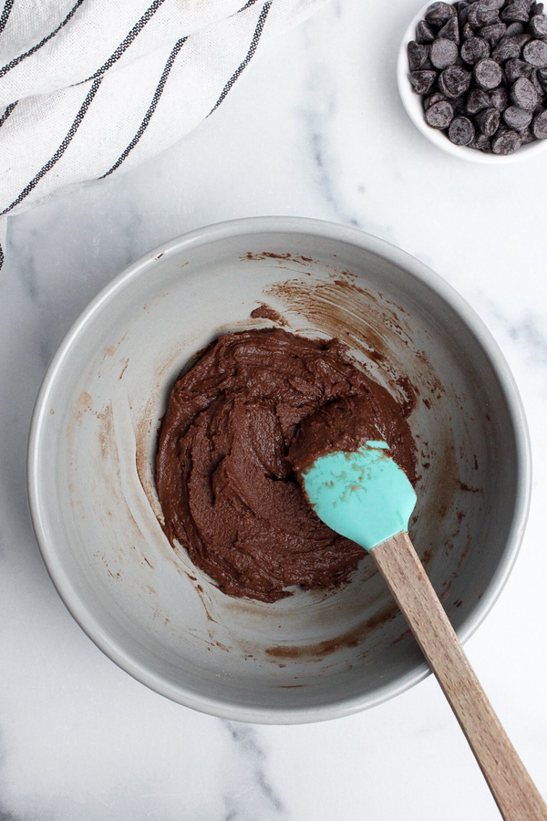 Protein brownie batter mixed together with a rubber spatula.