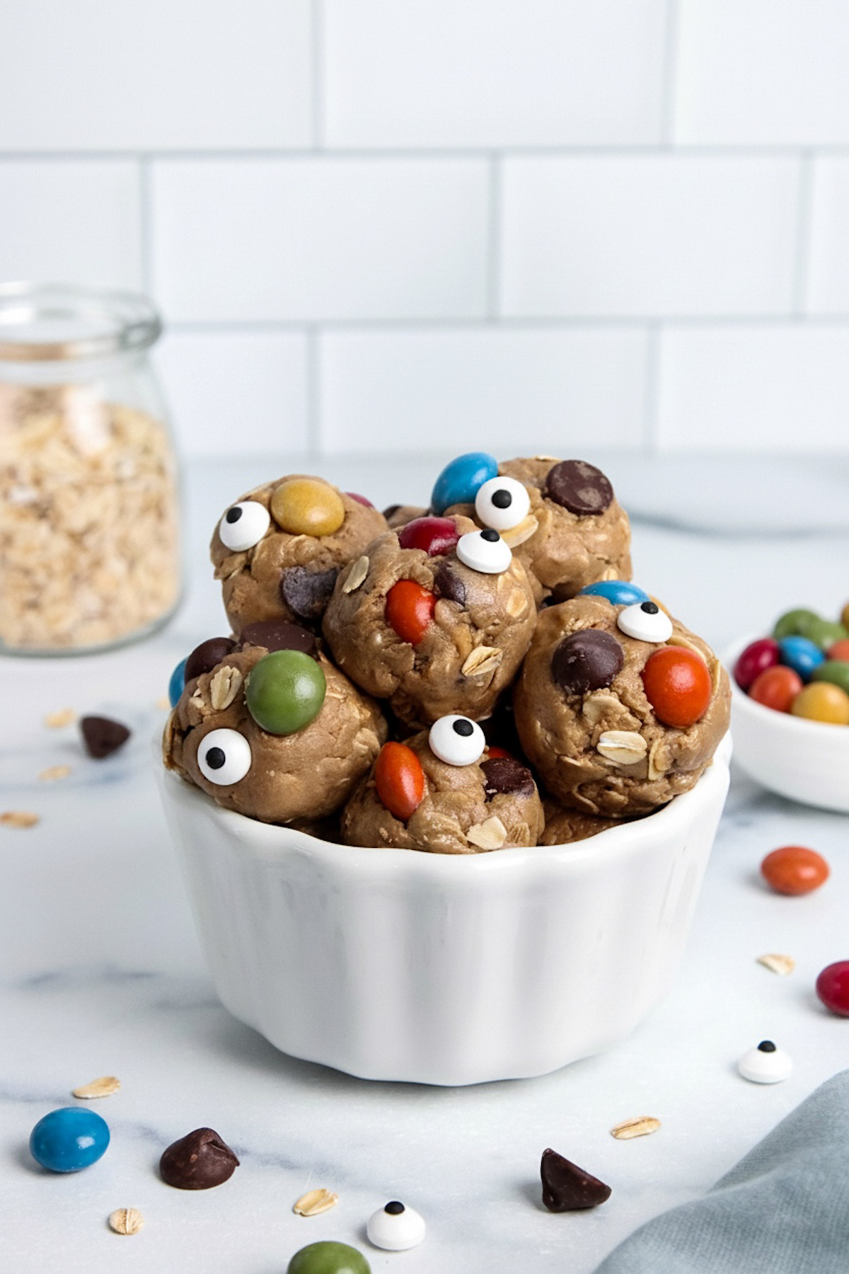 Halloween-themed monster cookie energy balls with candy eyes.