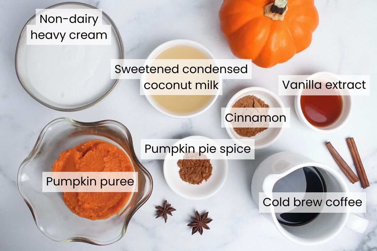 Ingredients for dairy-free pumpkin cream cold foam: dairy-free heavy cream, sweetened condensed coconut milk, pumpkin puree, vanilla extract, pumpkin pie spice, cinnamon, and cold brew coffee or coffee of choice.