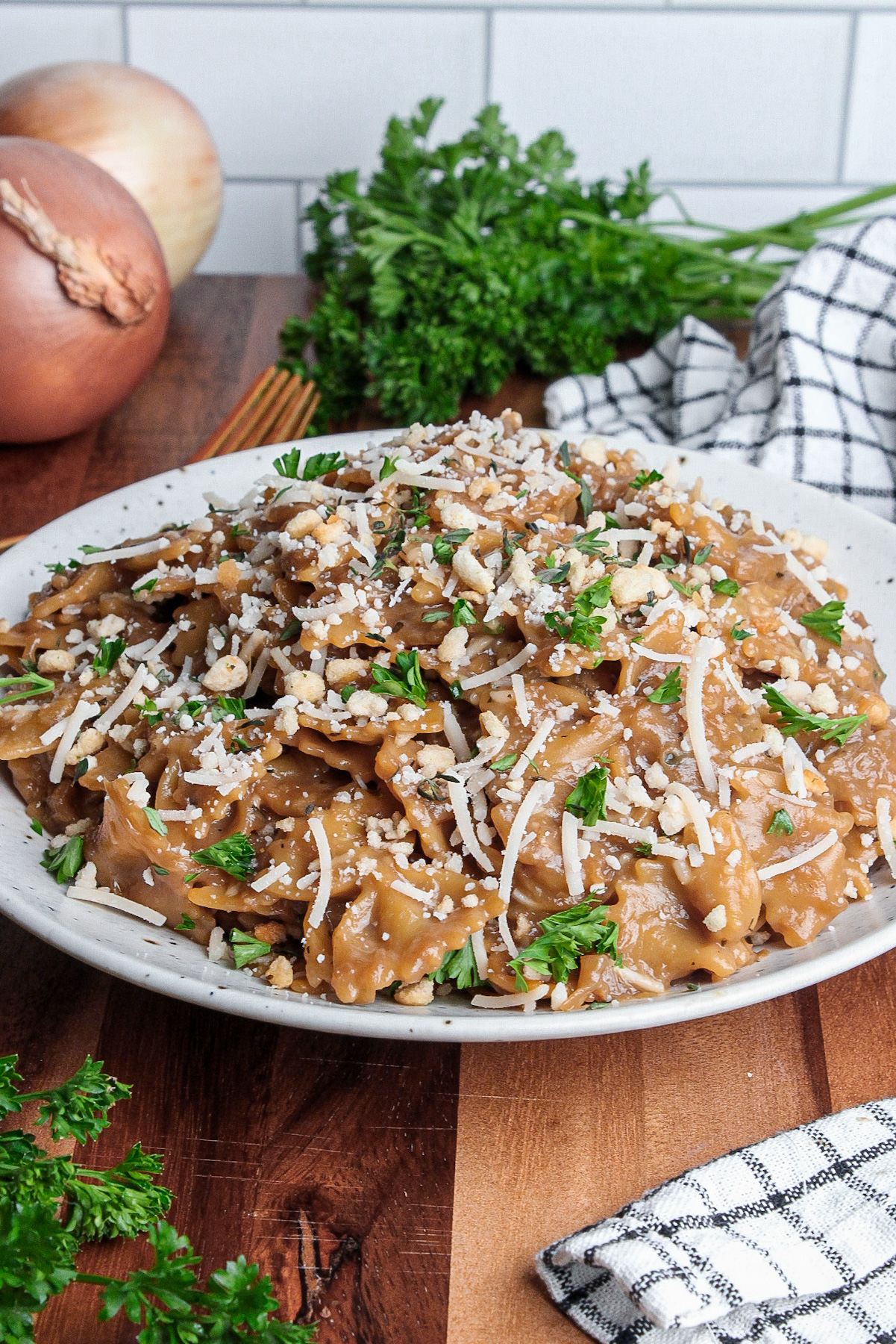 Plate of French onion pasta made with farfalle pasta as a variation.