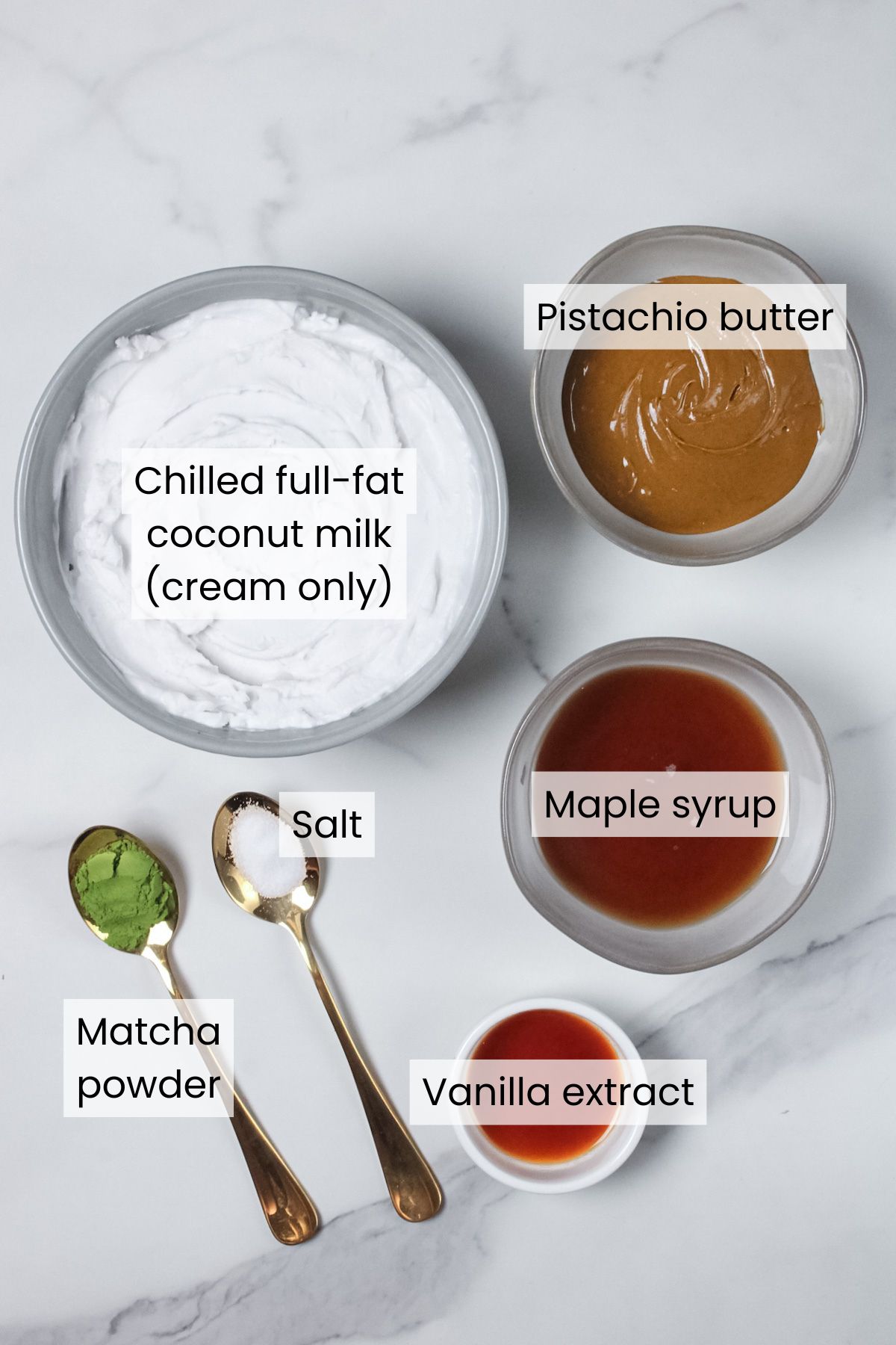 Ingredients for vegan pistachio mousse: chilled full-fat coconut milk (cream only), pistachio butter, maple syrup, vanilla extract, matcha powder (optional), and salt.