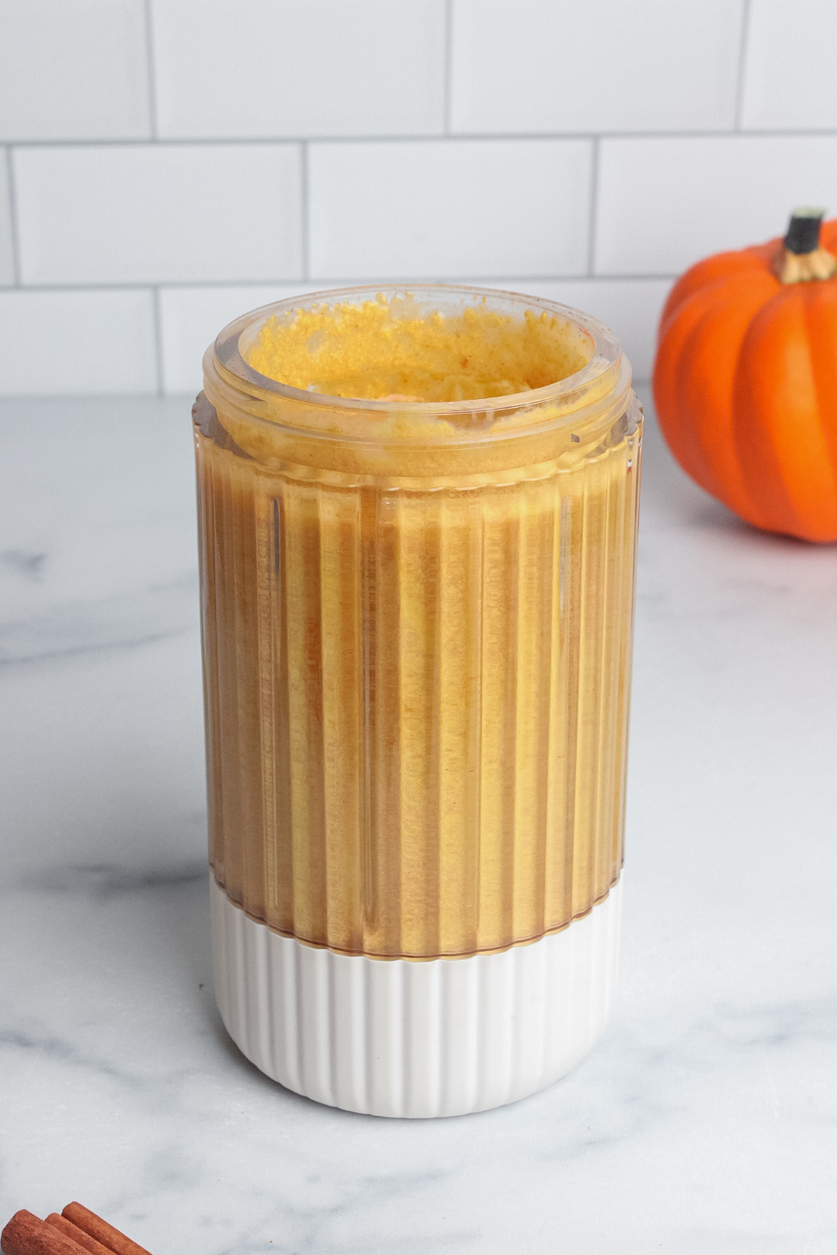 Pumpkin cream cold foam blended until smooth and light orange.